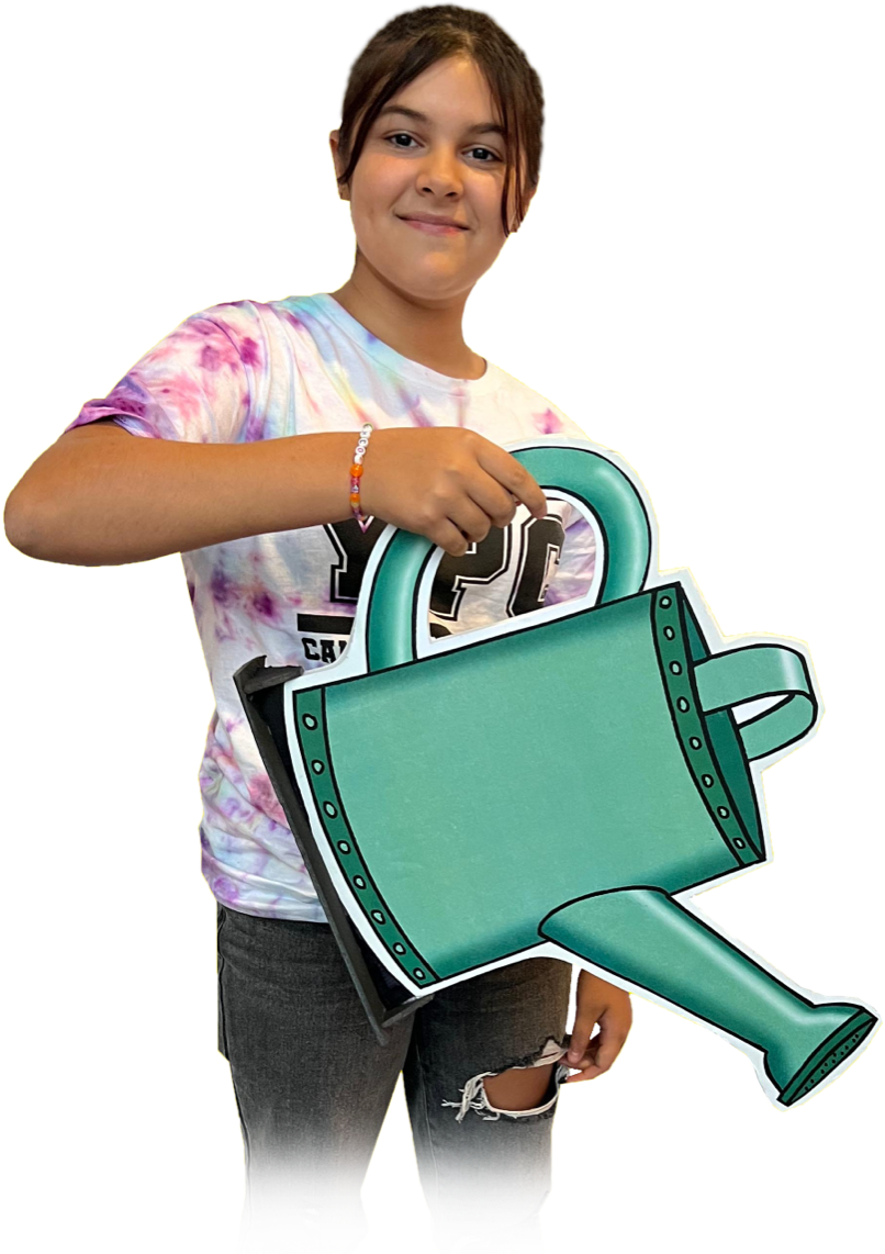 A young person holding a watering can prop